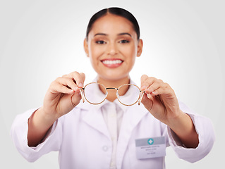 Image showing Glasses in hands, woman and portrait of optometrist in studio isolated on white background. Face smile, ophthalmologist and frame of happy medical professional optician for health in eye care vision
