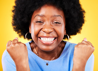 Image showing Black woman, face portrait and fist for success, celebrate promotion or winning lottery bonus on yellow background. Excited model, cheers or celebration of achievement, deal or lotto winner in studio