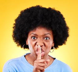 Image showing Angry, woman and portrait for noise sign, drama and secret privacy on yellow background in studio. Face, moody african model and warning with finger on lips for whisper, quiet emoji and silence voice