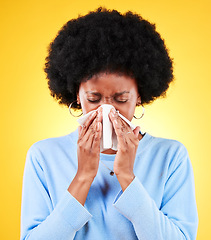 Image showing Nose, sneeze and sick woman in studio for cold, allergies and risk of medical virus on yellow background. African model, tissue and ill health of sinusitis, allergy and bacteria of winter infection