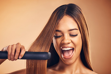 Image showing Excited, hair straightener and beauty of a woman in studio for cosmetics or mockup. Aesthetic model on brown background for wow heat treatment, healthy results and hairdresser or salon flat iron