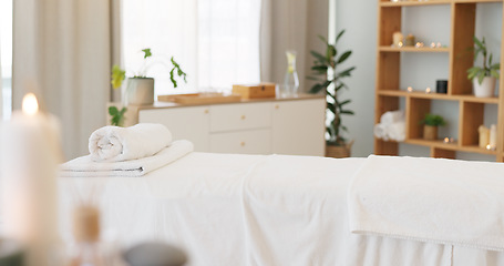 Image showing Wellness, relax and a massage table on an empty spa background for luxury wellness or treatment. Health, zen and hospitality with candles for peace or aromatherapy a room of a modern beauty salon