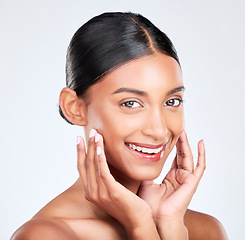 Image showing Portrait, woman and touch face in studio for clean skincare, aesthetic glow and healthy dermatology on white background. Happy young indian model, natural beauty and shine of facial cosmetic results