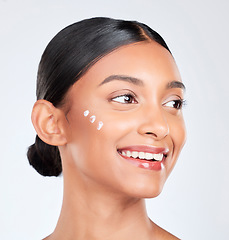 Image showing Cream, skincare and woman with cosmetics, beauty or self care on a white studio background. Person, thinking or model with creme, luxury or healthy skin with dermatology, glow or aesthetic with shine