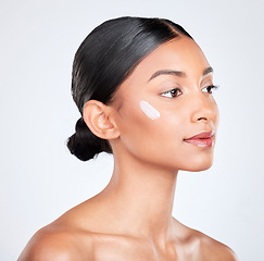 Image showing Thinking, cream or woman with skincare, beauty or dermatology on a white studio background. Person, idea or model with creme, moisturiser or luxury with self care, cosmetics or aesthetic with lotion