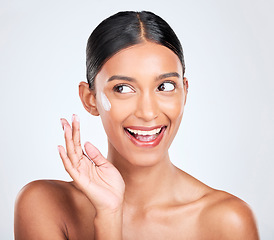 Image showing Happy woman, beauty and cream on face, dermatology and skincare on white background. Lotion, sunscreen and moisturizer with wellness, skin with glow and facial mask for cosmetic care in a studio