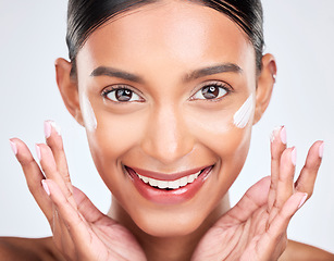 Image showing Portrait, cream and woman with dermatology, beauty and cosmetics on a white studio background. Face, person and model with lotion, shine and glow with moisturiser, creme and skincare with aesthetic