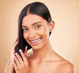 Image showing Happy, hair care and portrait of woman with beauty and glow from collagen in shampoo or cosmetics on studio background. Indian, face and model with haircare, treatment or healthy texture or shine