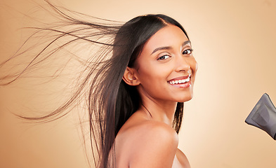 Image showing Hair, wind and hairdryer with woman in portrait, keratin treatment and beauty isolated on studio background. Shine, salon hairstyle and haircare with texture, growth and heat with electric appliance