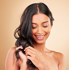 Image showing Hair care touch, happy woman and curly beauty in studio isolated on brown background. Hairstyle, natural cosmetics and model in salon treatment for texture growth, balayage and aesthetic for wellness