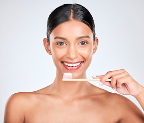 Image showing Toothbrush, toothpaste and dental with woman in portrait, health and fresh breath isolated on white background. Bamboo, face and teeth whitening with oral care, orthodontics and routine in studio