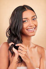 Image showing Portrait, hair care and woman with beauty, smile and treatment on a brown studio background. Face, person and model with shampoo, style and grooming with aesthetic, wellness and luxury with shine