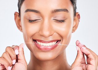 Image showing Mouth, flossing and dental with woman and face, health and fresh breath isolated on white background. Cleaning plaque, thread and teeth whitening with oral care, orthodontics and routine in studio