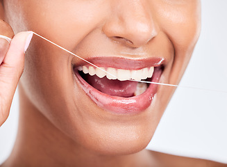 Image showing Mouth, flossing and dental with woman and closeup, health and fresh breath isolated on white background. Cleaning plaque, thread and teeth whitening with oral care, orthodontics and routine in studio