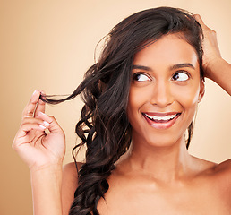Image showing Thinking, hair care and happy woman with natural beauty isolated in a studio brown background with strong texture. Aesthetic, glow and young person with cosmetic health, growth and shine color