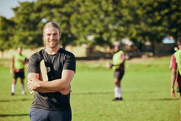 Image showing Portrait, fitness and a rugby coach on a field with his team training or getting ready for match competition. Exercise, sports and strategy with a happy male trainer on grass for practice workout