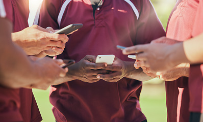 Image showing Sports, group and phone with hands of people on field for networking, teamwork and social media. Contact, fitness and health with closeup of friends in stadium for internet, communication and app