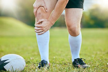 Image showing Knee pain, rugby legs and sports person tired, fatigue and sore training accident, match game or challenge on grass field. Body agony, athlete anatomy or closeup of player with medical emergency risk