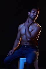 Image showing Topless, sexy man on black background for fitness inspiration, beauty aesthetic or healthy fantasy. Art, strong body and seductive male model with muscle, dark studio and neon blue lighting.