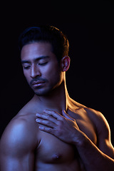Image showing Topless, dark portrait and sexy man in studio in fitness inspiration, beauty aesthetic or power fantasy. Alluring, strong body and seductive male model with muscle, black background and neon lighting