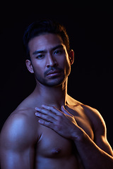 Image showing Topless, dark portrait and sexy man on black background in fitness inspiration, beauty aesthetic or bodybuilder fantasy. Healthy, strong body and male model with muscle, studio and neon lighting