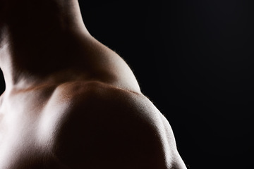 Image showing Shoulder, closeup and strong muscle of man in studio isolated on black background mockup space. Body, fitness athlete and arm of model, bodybuilder power and workout for health, wellness and exercise