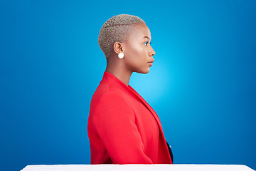 Image showing Profile, mockup and a business black woman in a red suit on blue background in studio as a professional. Vision, mindset and space with a serious corporate employee looking to a future of management