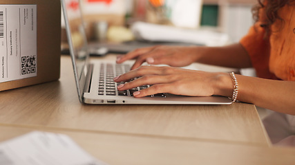 Image showing Hands, typing and laptop with boxes, logistics and e commerce in warehouse, workshop and shipping startup. Woman, computer and click for supply chain, store and cardboard package for delivery on desk