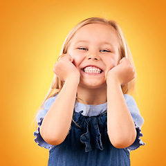 Image showing Portrait, child and girl with a smile, surprise and excited on a yellow studio background. Face, person and kid with happiness, announcement and good news with a prize, wow and winner with giveaway