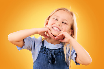 Image showing Portrait, kid and girl with surprise, wow and excited with happiness on a yellow studio background. Face, person and child with announcement, giveaway and good news with a prize, smile and winner