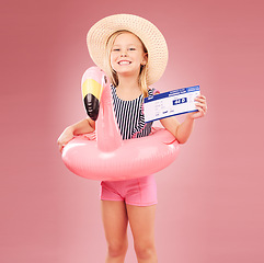 Image showing Travel, portrait and girl child with passport in studio for summer vacation or holiday on pink background. Face, ticket or kid with boarding pass, flight or traveling documents for airport compliance