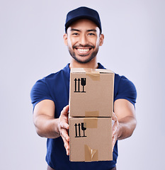 Image showing Smile, portrait and delivery guy with boxes in studio, safe transport for ecommerce supplier product. Package, logistics and happy courier mail man on white background for giving sales and services.