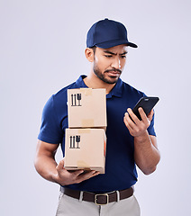 Image showing Phone, shipping box and confused delivery man reading online shopping problem, information or commercial export mistake. Supply chain error, smartphone and studio person crisis on white background