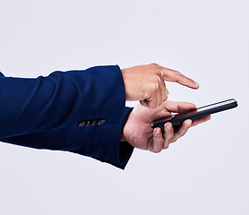 Image showing Phone, hands and closeup of man scroll on social media, mobile app or the internet for communication. Technology, networking and male person browsing on a website with cellphone by studio background.