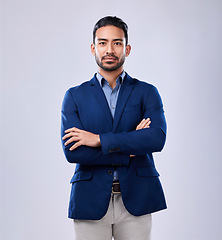 Image showing Portrait, serious and business man with arms crossed in studio isolated on a white background mockup space. Professional, entrepreneur and confident worker, employee and Mexican consultant in suit.