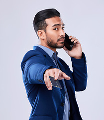 Image showing Phone call, credit card and a business man in studio for communication or fintech payment. Serious asian person with smartphone for membership subscription, account or banking info on grey background