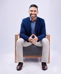 Image showing Portrait, smile and business man on chair in studio isolated on a white background mockup space. Professional attorney, happy and confident lawyer, legal employee and Mexican worker in law firm.