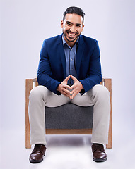 Image showing Portrait, happy and business man on chair in studio isolated on a white background. Professional attorney, smile and confident lawyer, legal employee and Mexican worker in corporate suit at law firm.