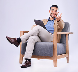 Image showing Portrait, tablet and a man psychologist in a chair on a white background in studio to listen for diagnosis. Psychology, mental health and smile with a person counseling during a therapy session