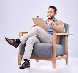 Image showing Documents, diagnosis and a man psychologist in a chair on a white background in studio to listen for diagnosis. Psychology, mental health and trauma with a person counseling during a therapy session