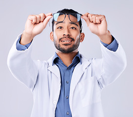 Image showing Man, glasses and vision of ophthalmologist at studio isolated on a white background. Frame, spectacles and optometrist, doctor and medical professional with lens, healthcare or wellness of optician