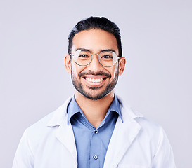 Image showing Happy, portrait and man doctor in a studio with glasses for vision, eye care and wellness. Smile, confidence and headshot of an Indian male healthcare professional with spectacles by white background