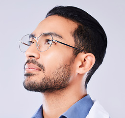 Image showing Thinking, glasses and a man or doctor on a studio background for healthcare or medical vision. Medicine, idea and an Asian nurse or surgeon with a service solution or optometry on a backdrop