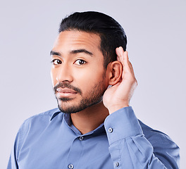 Image showing Hands, ear and portrait of asian man in studio for gossip, listening or speak up sign on grey background. Hearing, secret and face of Japanese guy model with emoji icon for deaf, sign language or huh
