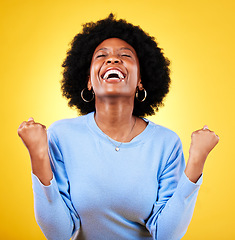 Image showing Black woman, excited and fist in studio for success, celebrate freedom or winning lottery bonus on yellow background. Happy model, cheers or celebration of good news, crazy deal or lotto prize winner