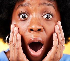 Image showing Scared, shock and surprised woman in studio for fear, mental health or closeup. Portrait of African person on yellow background with mouth open, hands on face with a phobia, gossip news or horror