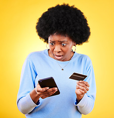 Image showing Surprised, credit card and woman with phone scam and shock from problem and tech in studio. Stress, mobile and confused from phishing, hacking and ecommerce spam with anxiety and yellow background