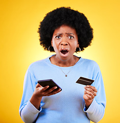 Image showing Shock, credit card and woman portrait with phone scam and fraud from problem in studio. Stress, mobile and confused from phishing, hacking and ecommerce spam with anxiety and yellow background