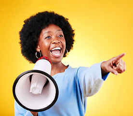 Image showing Happy woman, loudspeaker or megaphone and pointing in studio for voice or announcement. African person with speaker for broadcast message, breaking news or speech communication on yellow background