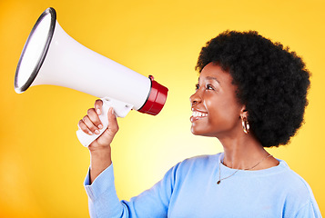 Image showing Happy black woman, profile and megaphone in promotion, advertising or marketing on a yellow studio background. African female person, smile or voice with loudspeaker in sale announcement or alert